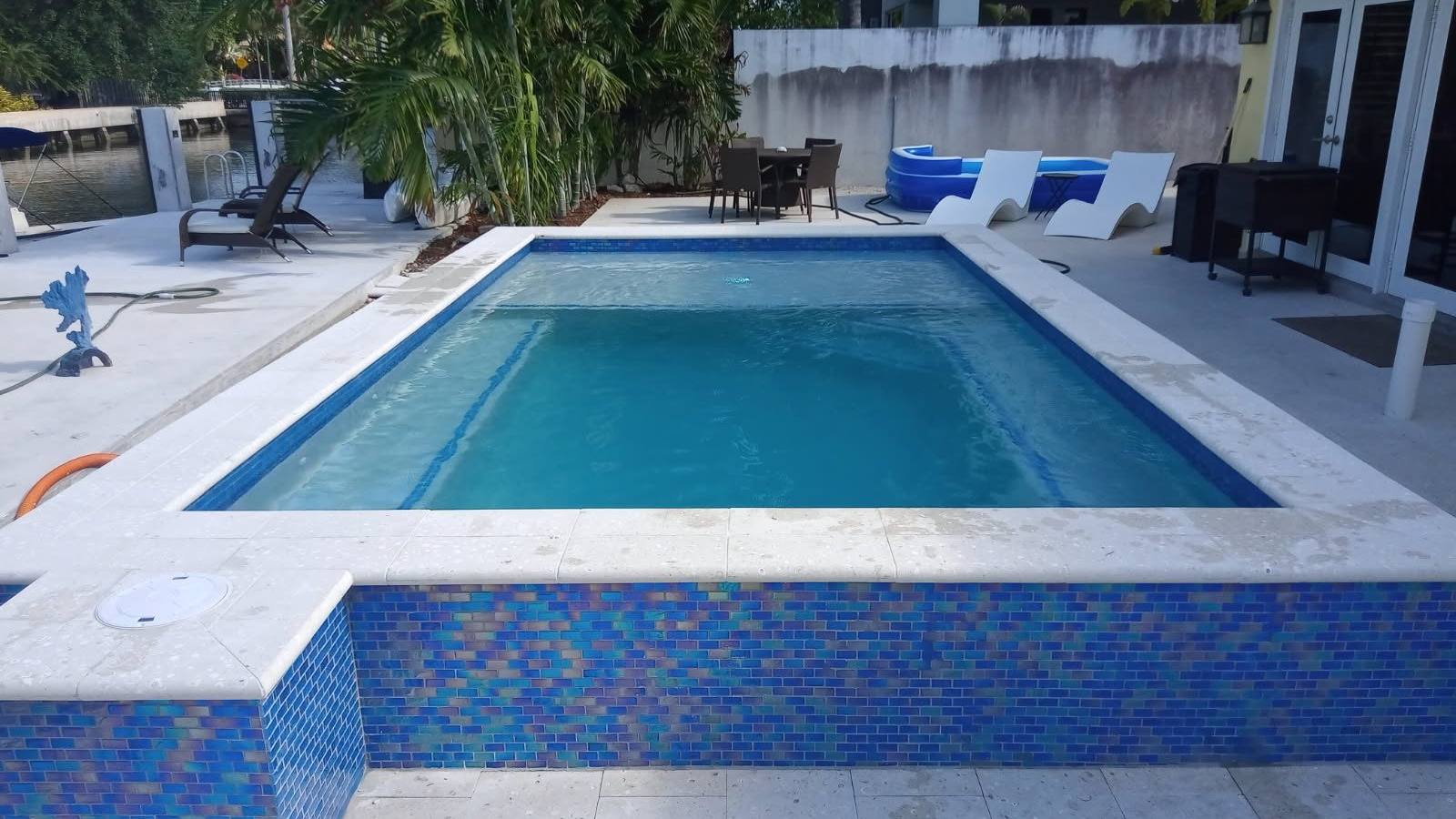 Custom pool and patio project by Cliff's Pools & Patios for Palm Beach Gardens, FL homeowners