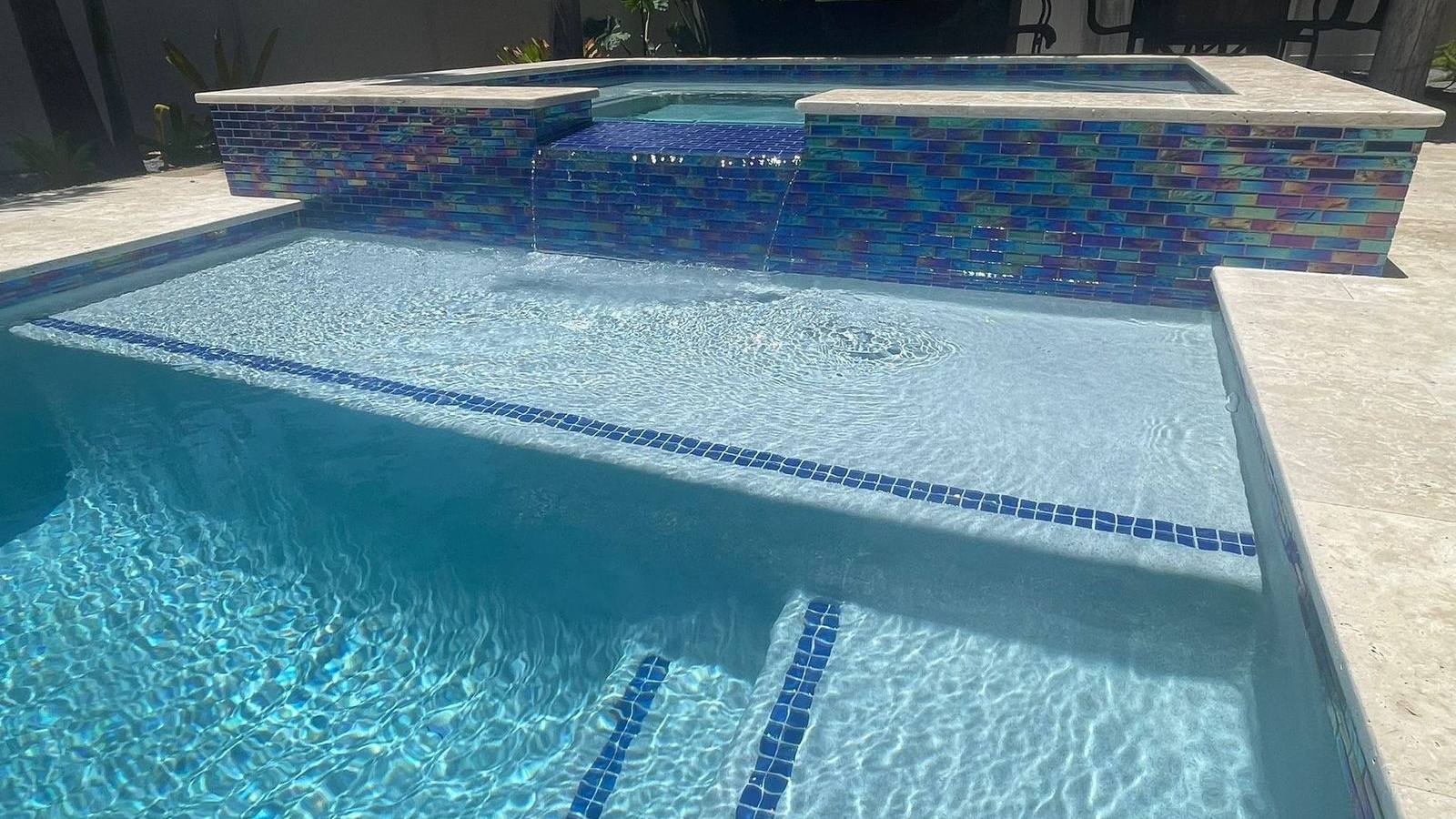 Custom pool and patio project by Cliff's Pools & Patios for Palm Beach Gardens, FL homeowners