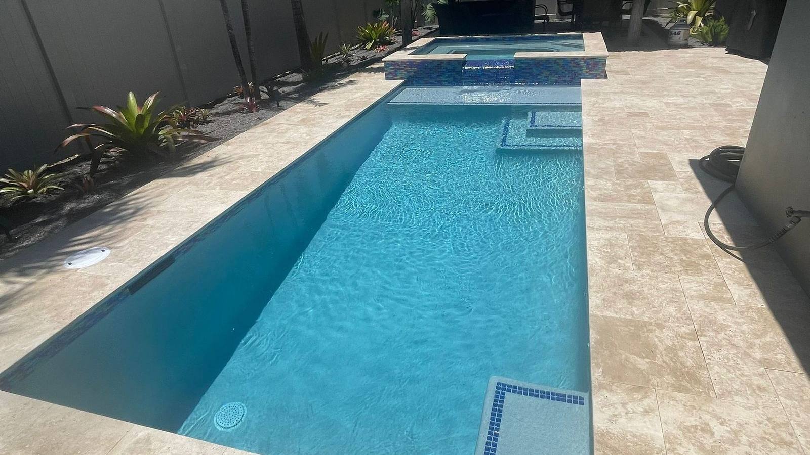 Custom pool and patio project by Cliff's Pools & Patios for Westlake, FL homeowners