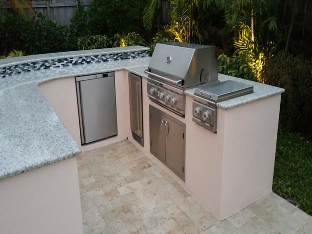 Cliff's Pools & Patios stainless outdoor kitchen with travertine deck - serving Lauderhill, FL