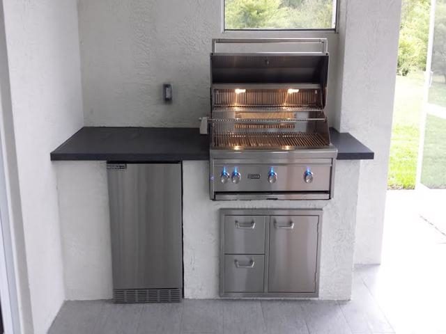 Cliff's Pools & Patios modern stainless outdoor kitchen with dark counter - serving Wilton Manors, FL