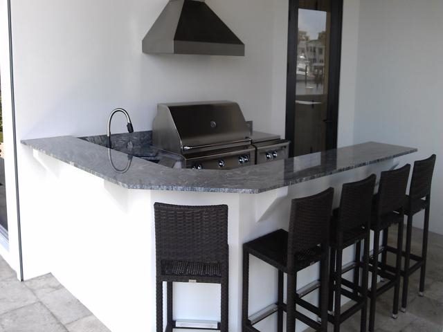 Cliff's Pools & Patios dark granite peninsula with stainless - serving Lake Worth Beach, FL