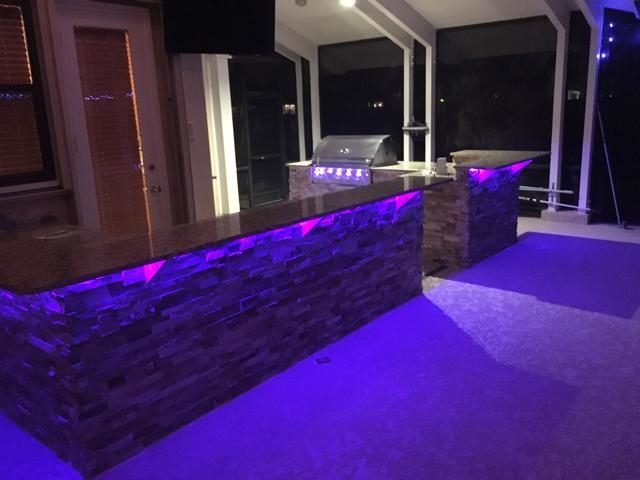 Cliff's Pools & Patios modern outdoor kitchen with LED accent lighting - serving Pompano Beach, FL