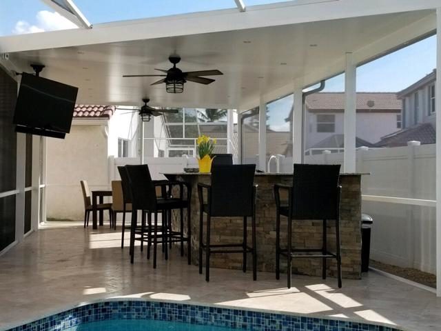 Cliff's Pools & Patios covered outdoor kitchen and dining area - serving Margate, FL