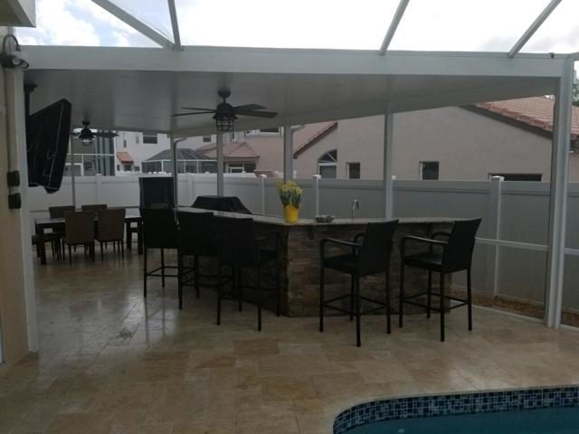 Cliff's Pools & Patios pool-side outdoor kitchen with bar seating - serving Plantation, FL