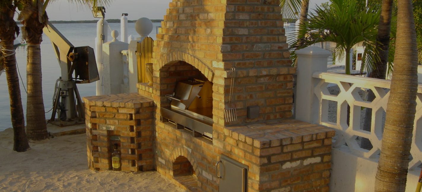 Cliff's Pools & Patios brick outdoor kitchen with wood-fired pizza oven - serving Wellington, FL