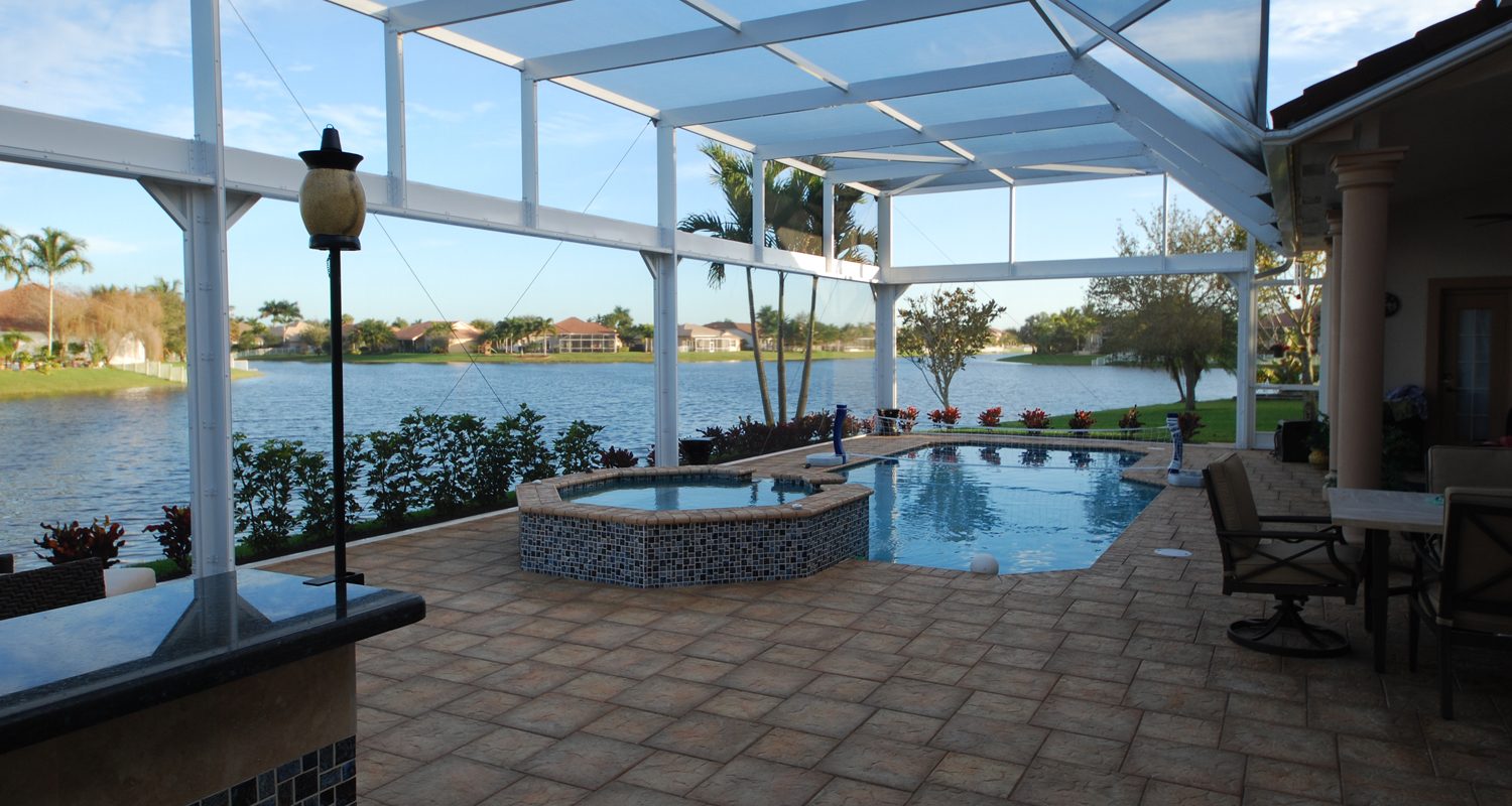 Cliff's Pools & Patios screen enclosure over pool with lake view