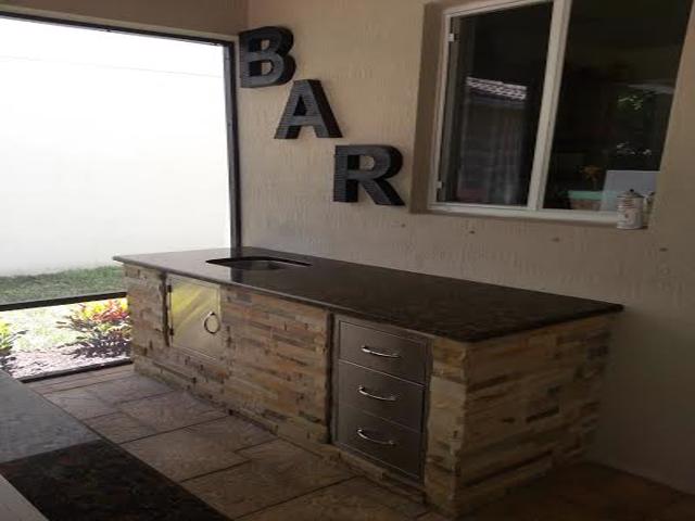 custom outdoor kitchen and bar