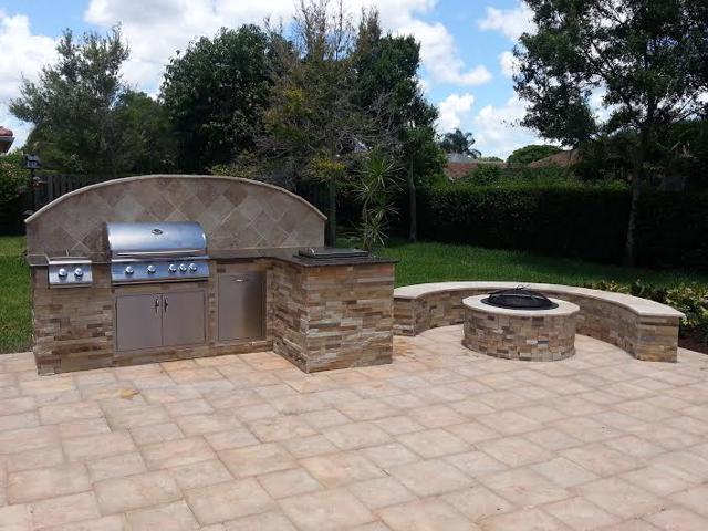 custom outdoor kitchen with BBQ and firepit